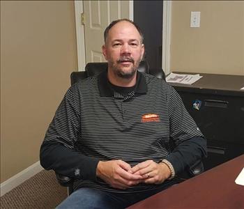 A man sitting at a desk